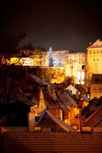 Buildings in city at night