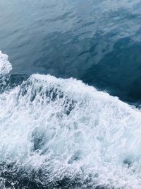 High angle view of waves splashing in sea