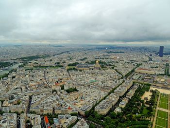 High angle view of cityscape against cloudy sky