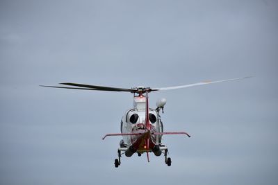 Low angle view of helicopter against clear sky