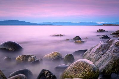 Scenic view of sea against cloudy sky