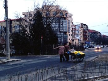 Woman standing on city street