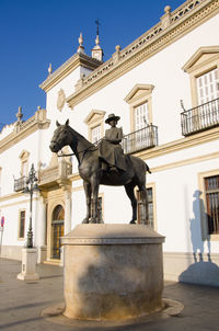 Statue of historic building against clear sky