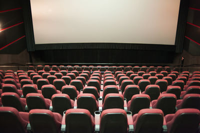 Rear view of empty chairs in stadium