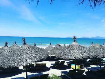 Scenic view of beach against blue sky