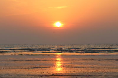 Scenic view of sea against sky at sunset