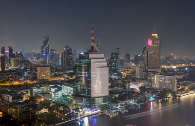 Illuminated buildings in city at night