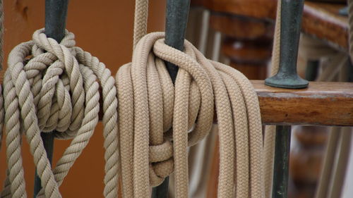 Close-up of rope tied to railing