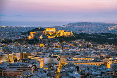 High angle view of city buildings at dusk