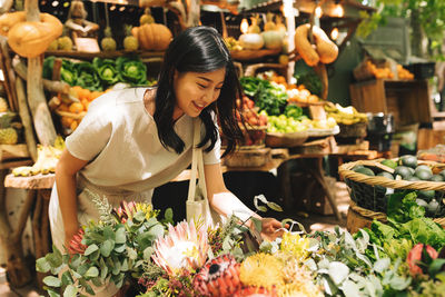 Portrait of young woman in market