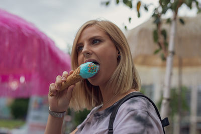 Portrait of woman eating ice cream