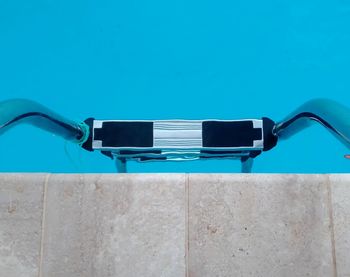 Close-up of swimming pool against clear blue sky