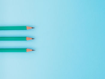 Close-up of colored pencils against white background