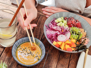 Midsection of man preparing food on table