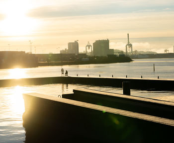 Lone fisherman against the rising sun