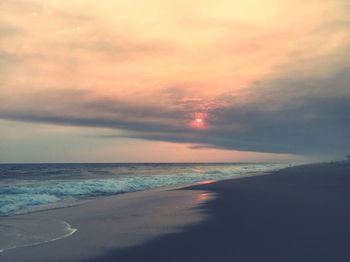 Scenic view of beach during sunset