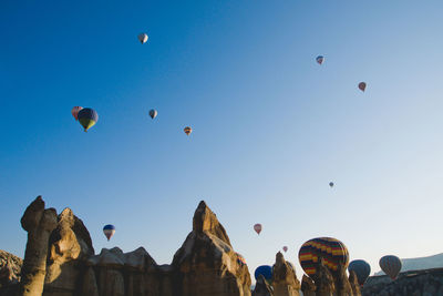 Low angle view of hot air balloons against sky