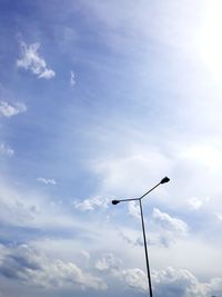 Low angle view of street light against sky