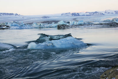 View of ice in lake against sky