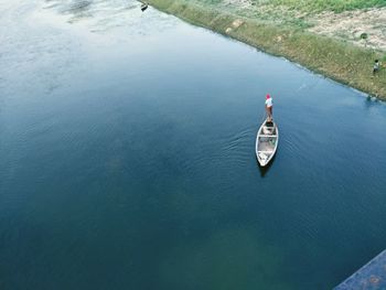 High angle view of man on boat in lake