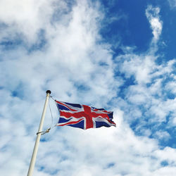 Low angle view of flag against sky