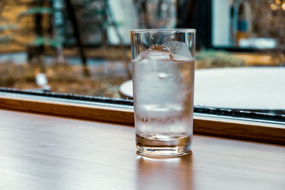 Close-up of glass of water on table