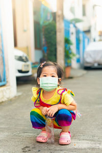 Portrait of cute girl with umbrella