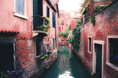 Canal amidst buildings in city