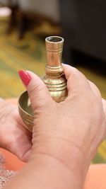 Midsection of woman holding drink