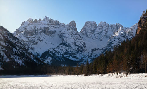 Scenic view of snowcapped mountains against clear sky