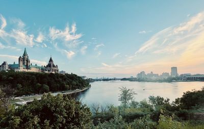 Panoramic view of buildings against cloudy sky. ottawa river, parlement hill canada 