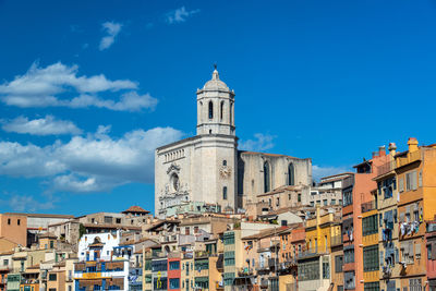 Low angle view of buildings against blue sky