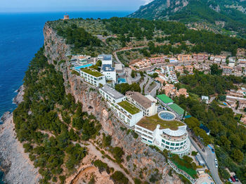 Aerial view of the luxury cliff house hotel on top of the cliff on the island of mallorca.