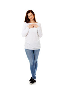 Portrait of a smiling young woman over white background