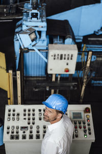 Man working in front of building