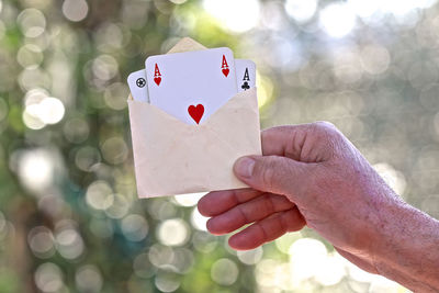 Close-up of person holding heart shape