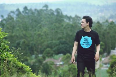 Full length of teenage boy standing on land