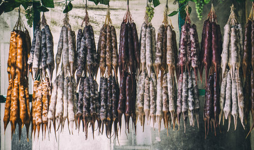 Panoramic shot of food hanging in market stall