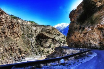 Mountain road against blue sky