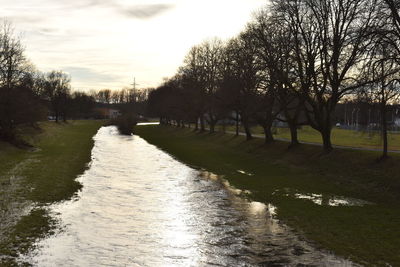 Scenic view of river against sky during sunset