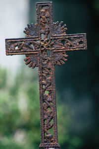 Close-up of cross at cemetery