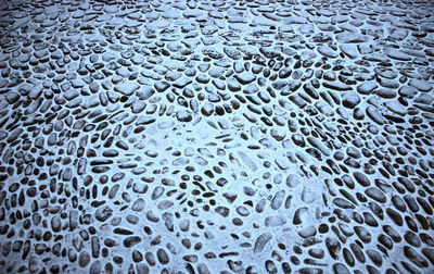 Full frame shot of raindrops on sea