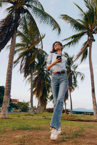 Full length of woman standing on field
