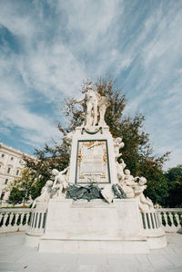 Low angle view of statue against sky