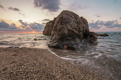 Scenic view of sea against cloudy sky