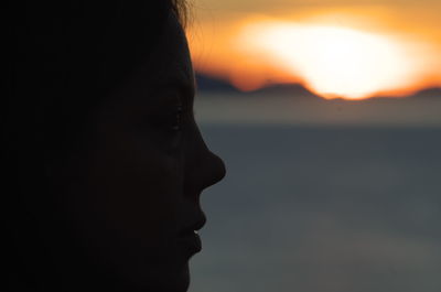 Profile of woman during sunset