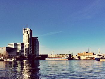 View of built structures against clear blue sky