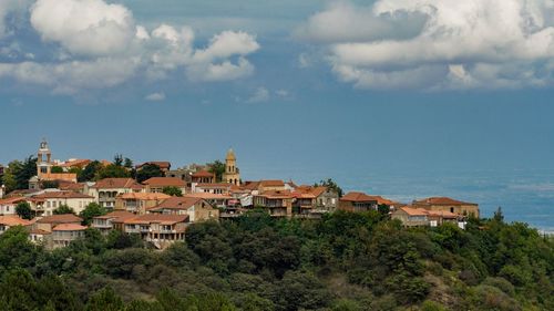 Houses in town against sky