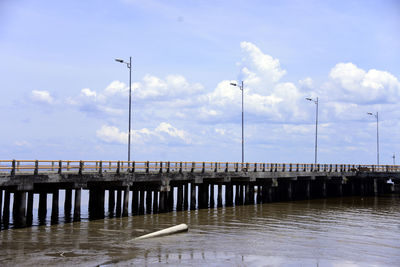 Pier over sea against sky