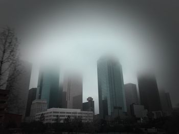 Low angle view of buildings in city against sky